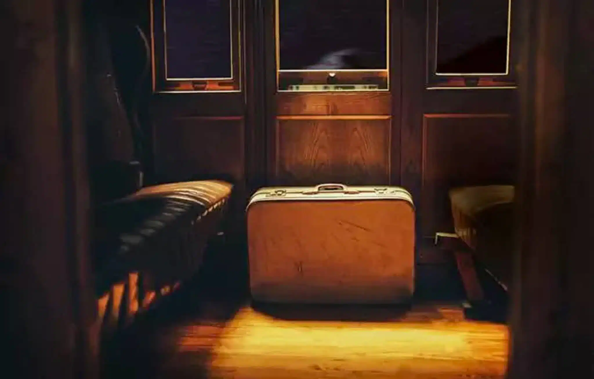 A suitcase in a train cabin