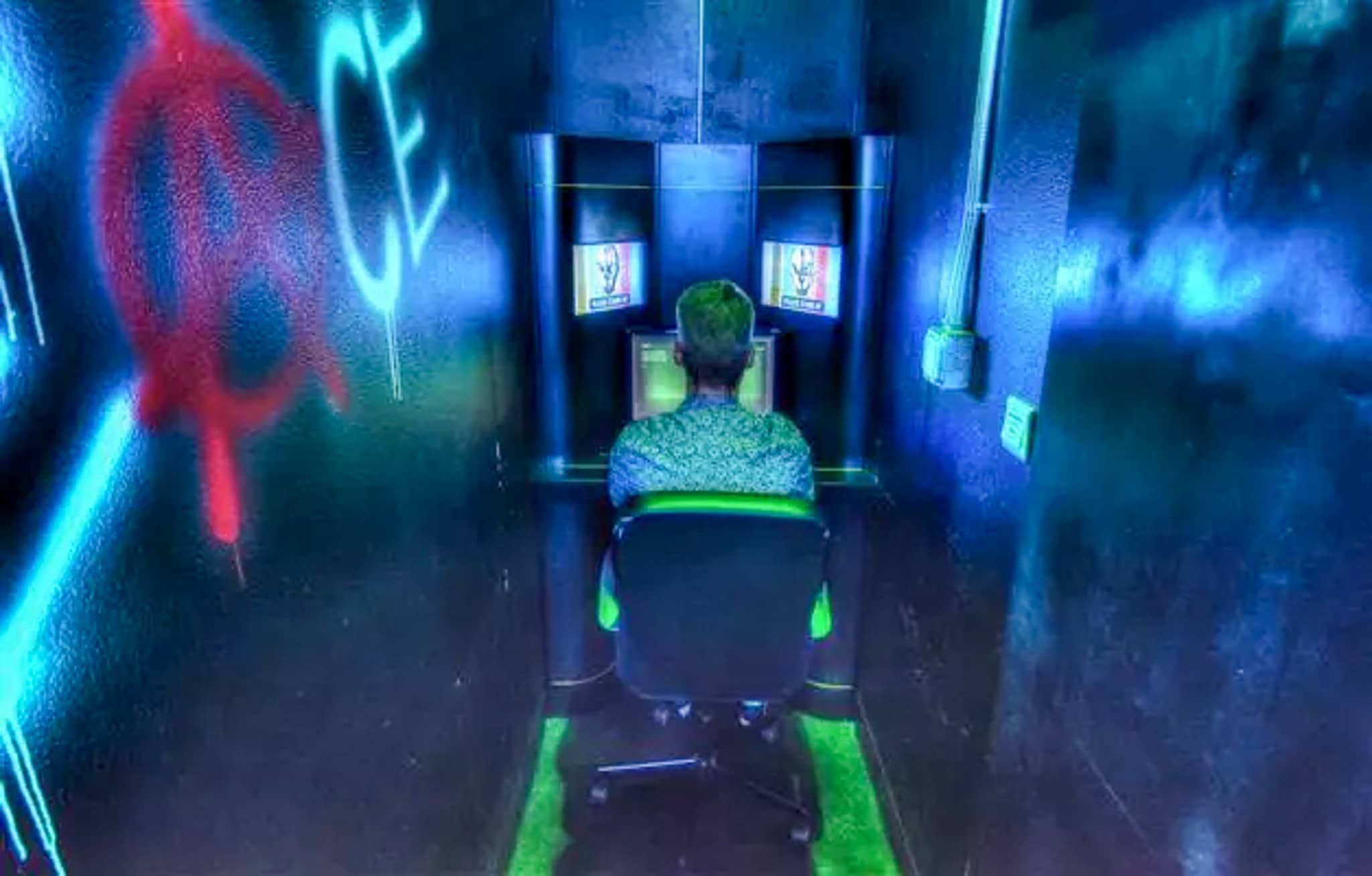 One person at a computer in a very narrow room