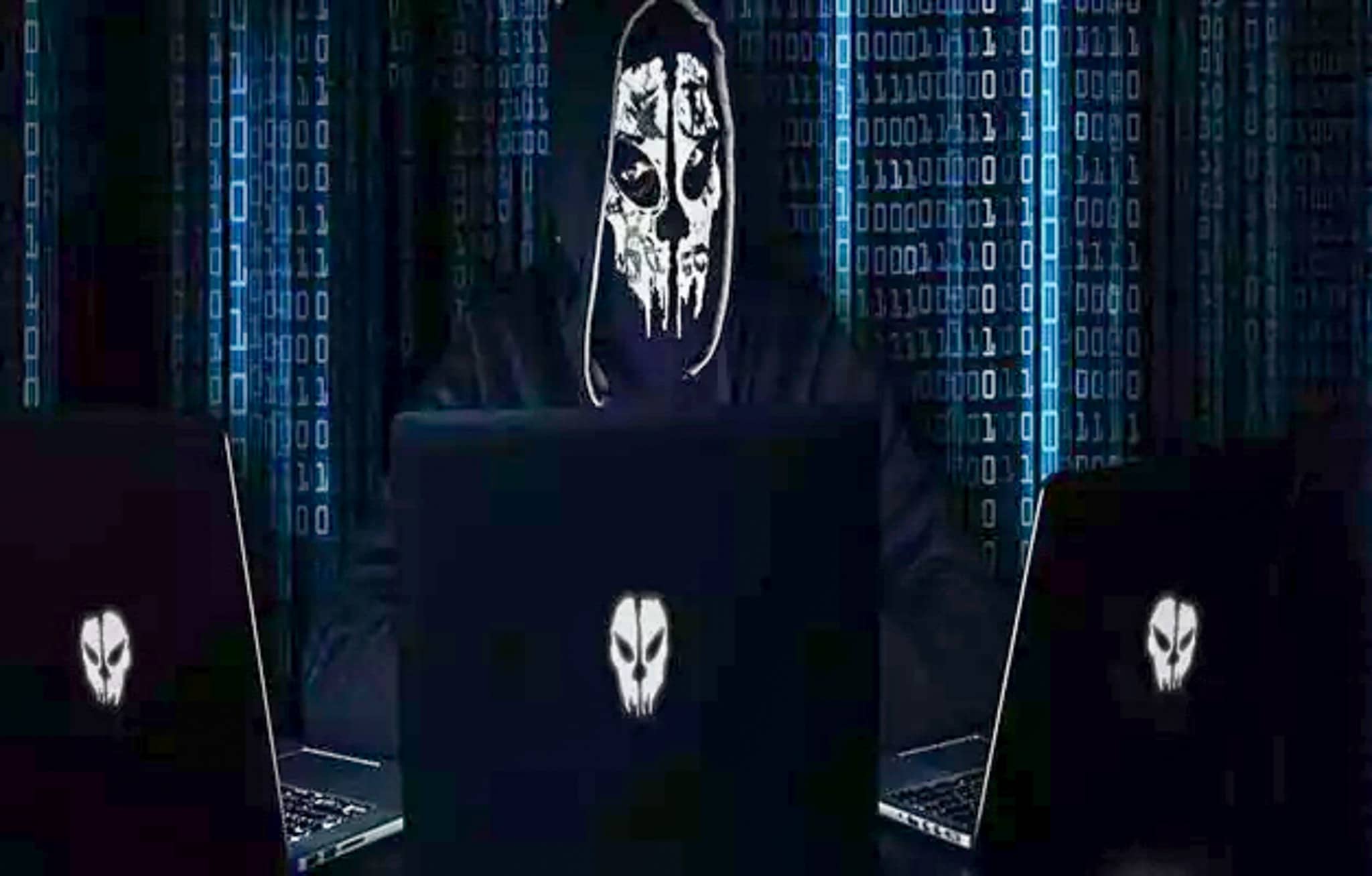 A skeleton in front of 3 computers